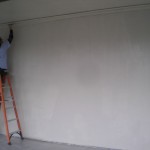 A volunteer paints during the 2011 ServeINC project.
