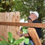 Voluntters put up a new fence at the Love Inc property.