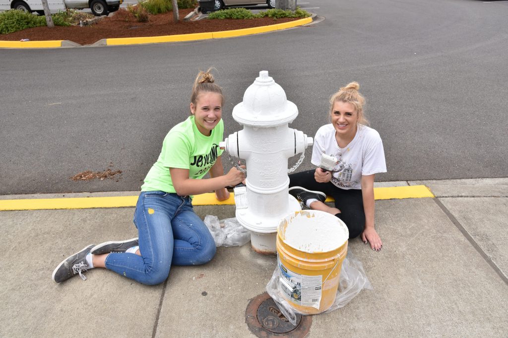 Volunteers also painted curbs and hydrants at Timber Ridge School.